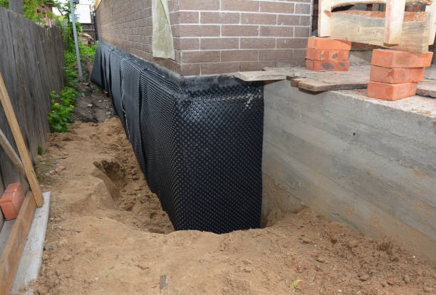 Happy homeowners after waterproofing job in Casco